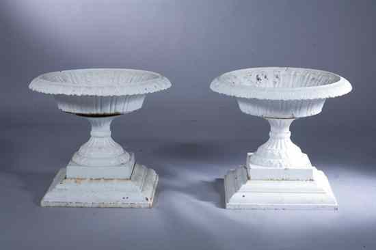 Appraisal: SET FOUR WHITE PAINTED CAST IRON GARDEN URNS Flaring round