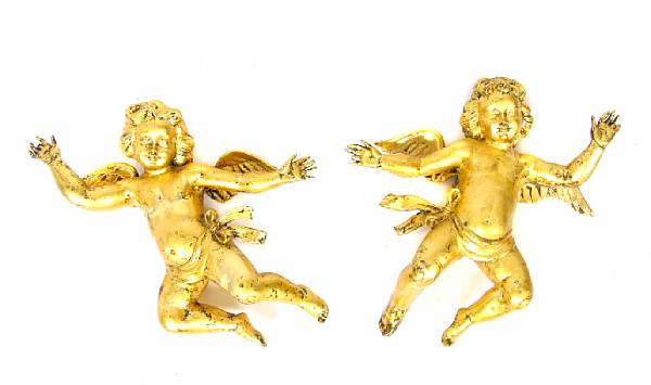 Appraisal: A pair of giltwood cherubs together with a two light