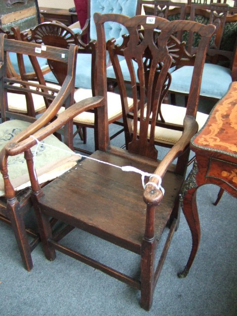 Appraisal: A George III oak open armchair with serpentine crest and