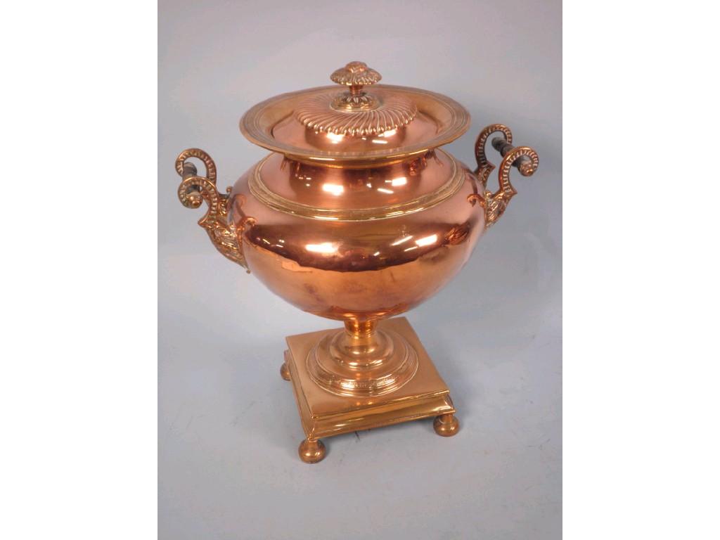 Appraisal: A George IV copper and brass two handled samovar cast