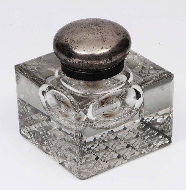 Appraisal: A cut glass inkwellwith silver mounted lid of plain form