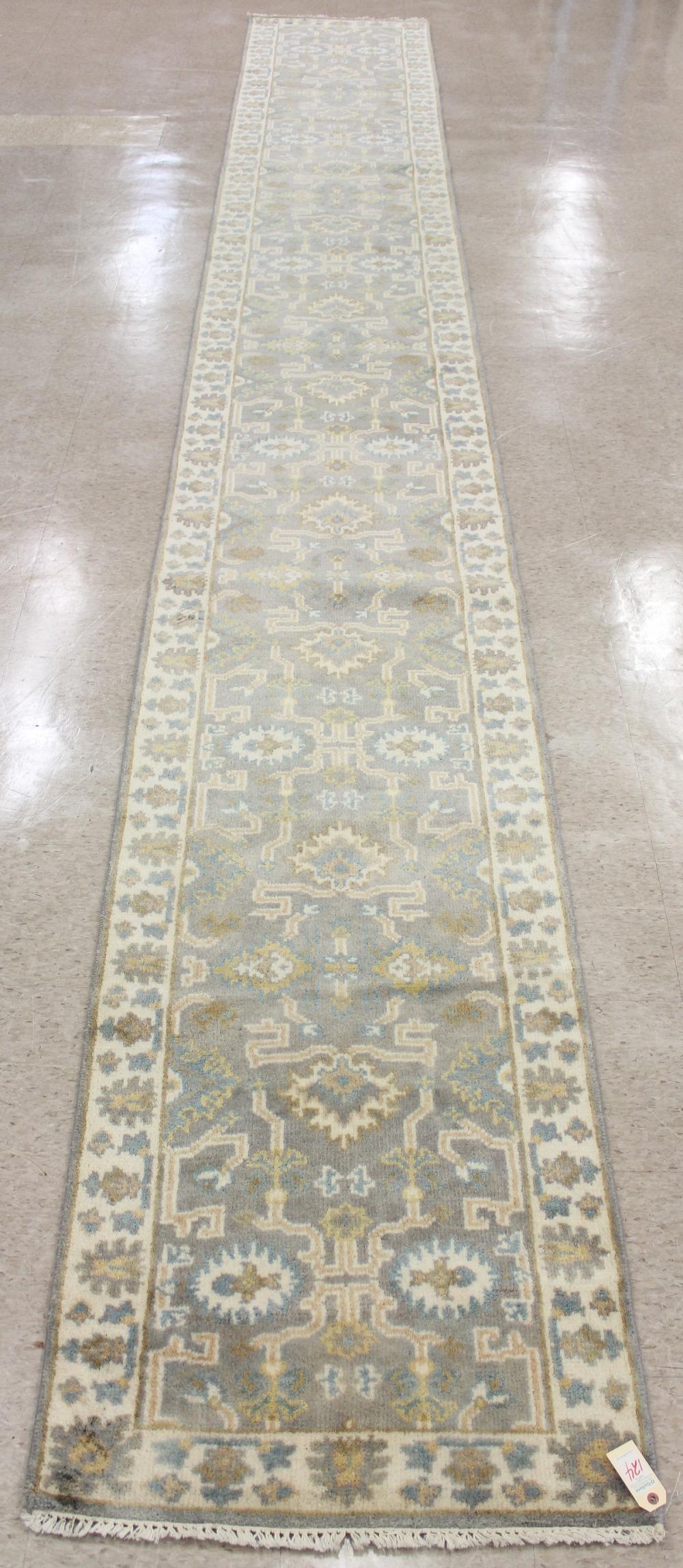 Appraisal: HAND KNOTTED ORIENTAL RUNNER Indo-Persian overall floral design light gray