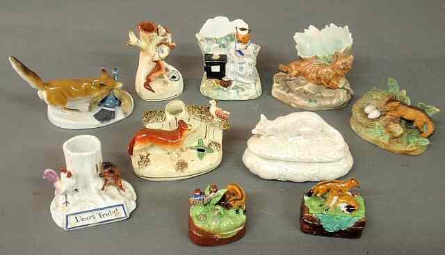 Appraisal: Group of ten porcelain fox figural group covered boxes spill