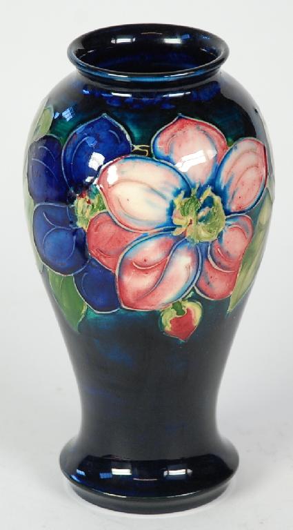 Appraisal: MOORCROFT POTTERY BALUSTER VASE painted autour with large dahlia flowers