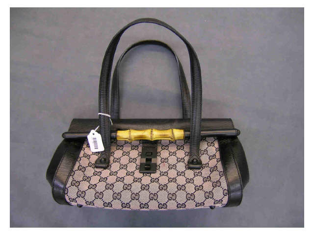 Appraisal: Gucci handbag pink logo fabric and black leather with leather