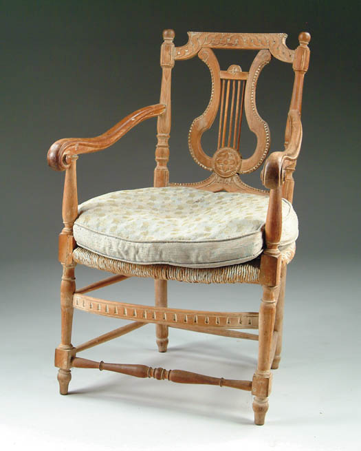 Appraisal: FRENCH LYRE BACK CARVED ARMCHAIR Large rush seat well carved