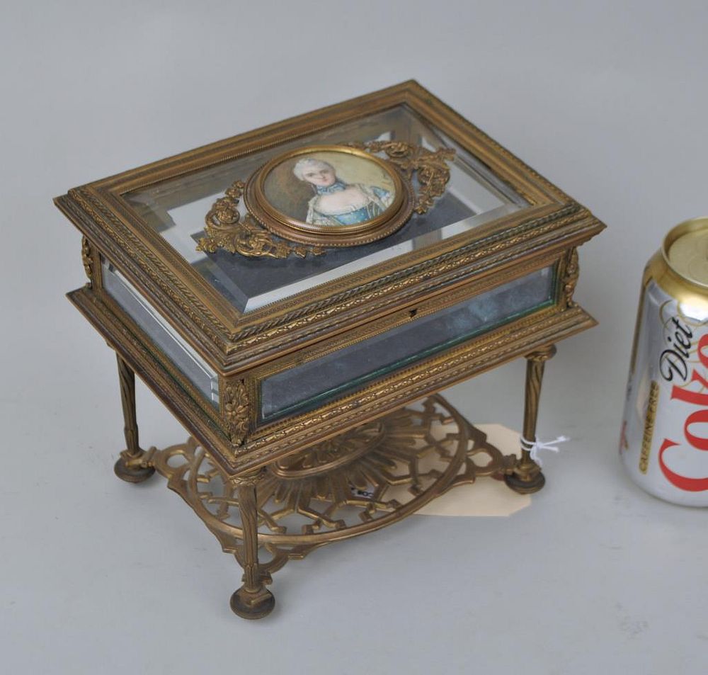 Appraisal: French Bronze Tabletop Curio with miniature painting of an aristocratic