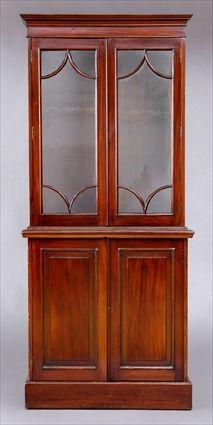 Appraisal: EARLY VICTORIAN MAHOGANY BOOKCASE CABINET The flat top cornice above