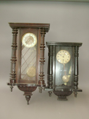 Appraisal: A Continental wooden cased regulator type wall clock the case