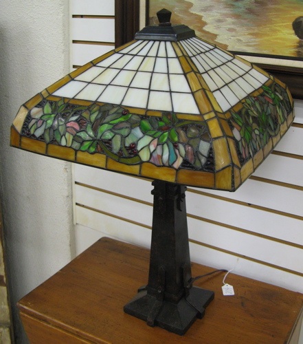 Appraisal: AN ARTS AND CRAFTS STYLE TABLE LAMP The patinated metal