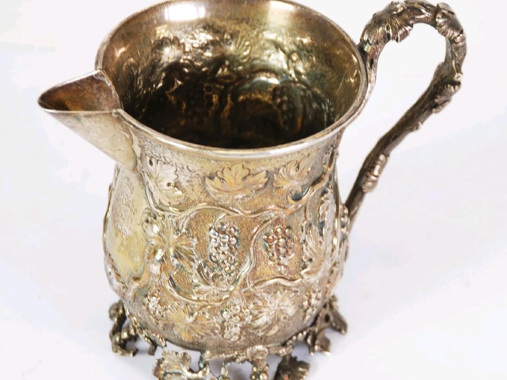 Appraisal: VICTORIAN EMBOSSED SILVER PRESENTATION MILK JUG converted from a Christening