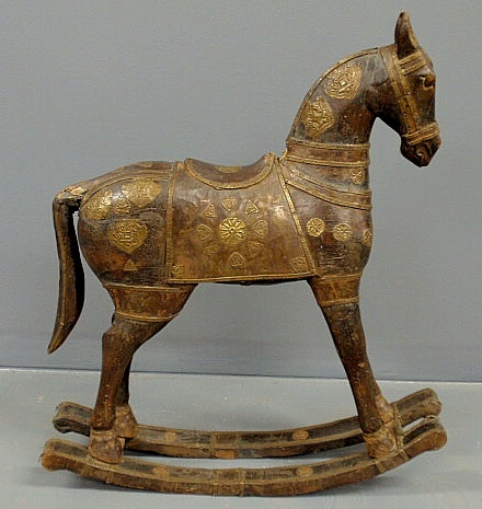 Appraisal: Carved Persian rocking horse th c with brass mounts h