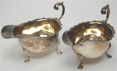 Appraisal: A pair of modern silver sauceboats Birmingham with everted scalloped