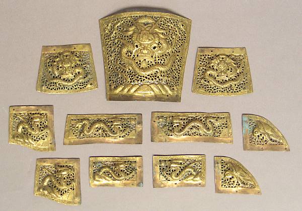 Appraisal: A group of eleven parcel-gilt metal reticulated plaques Late Qing