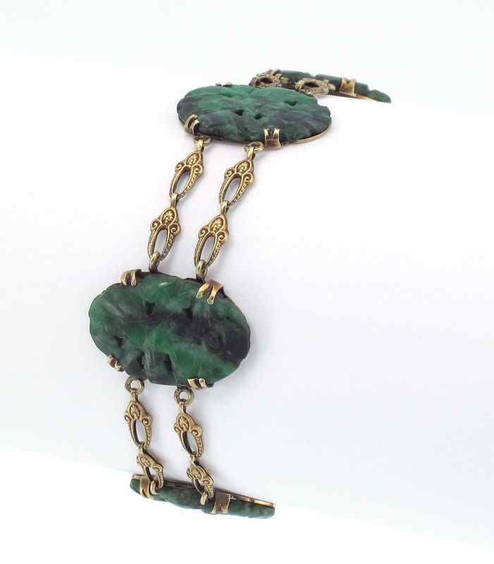 Appraisal: K GOLD CARVED JADE PANEL BRACELET K yellow gold bracelet