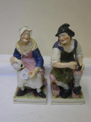 Appraisal: A PAIR OF LARGE STAFFORDSHIRE POTTERY FIGURES modelled as a