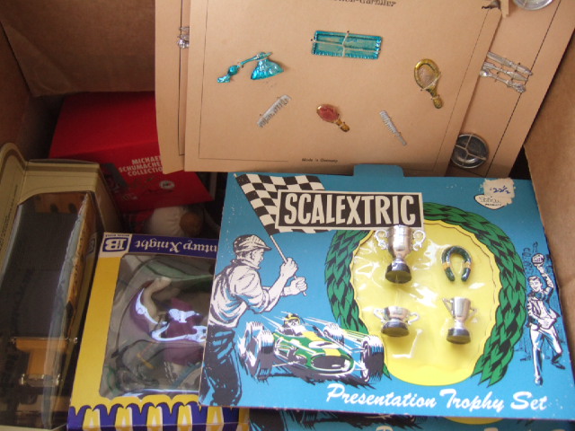 Appraisal: A quantity of toys including three Scalextrics presentation trophy sets