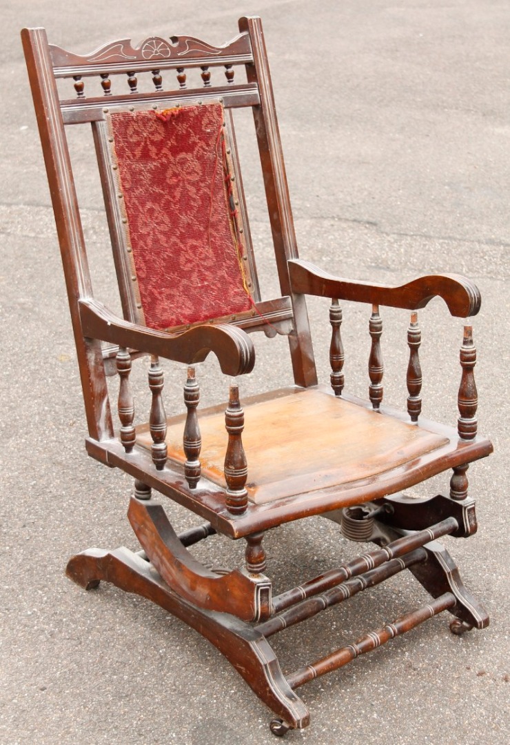 Appraisal: A thC walnut American rocking chair with embroidered back and