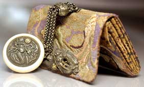 Appraisal: ANTIQUE POUCH SET AND MANJU Very finely embroidered antique tobacco