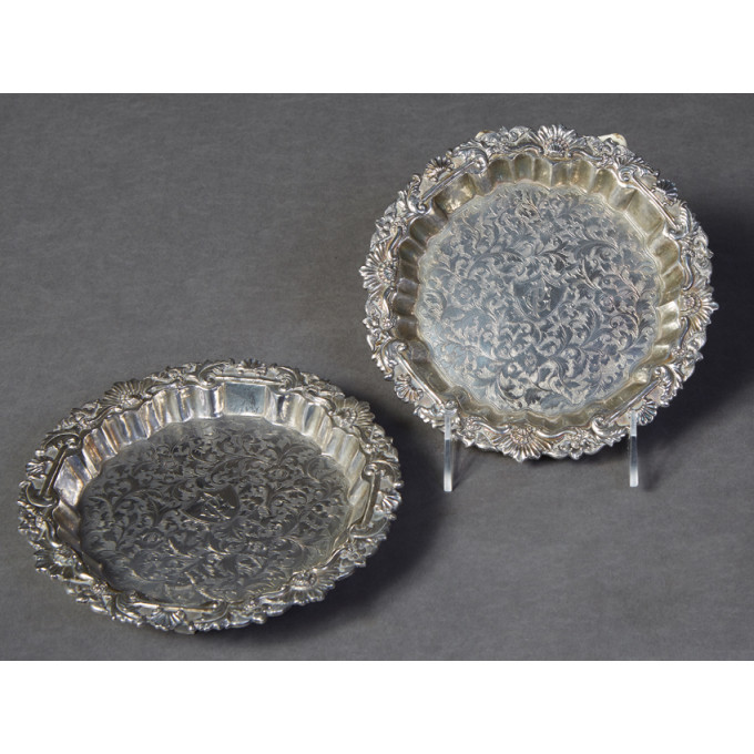 Appraisal: Pair of English Sterling Bottle Coasters th c the relief