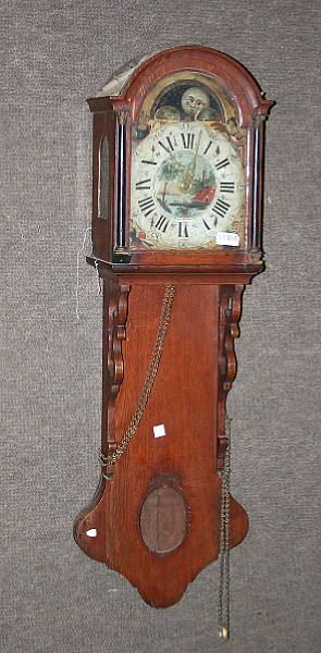 Appraisal: A German parcel gilt and parcel ebonized oak wall clock