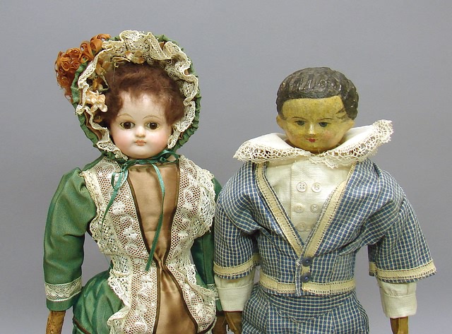 Appraisal: Pair of papier mache dolls Male doll with molded black