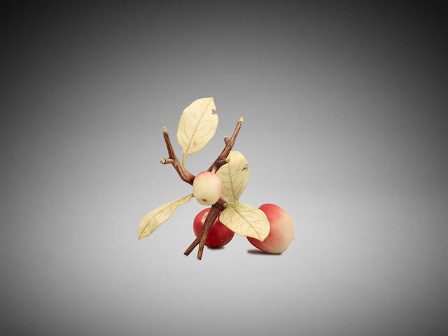 Appraisal: A Japanese stained ivory okimono of a branch of apples