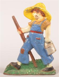 Appraisal: Vintage Painted Cast Iron Boy with Pail Doorstop - h