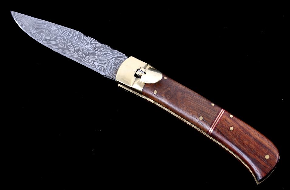 Appraisal: German Lever Lock Damascus Switchblade Knife The lot features a