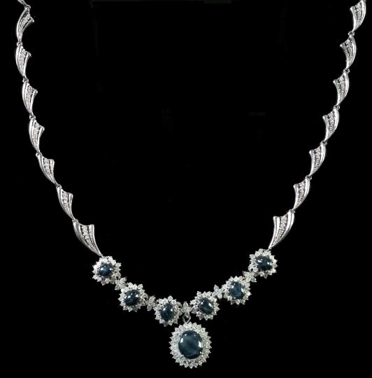 Appraisal: Fourteen-Karat White Gold Star Sapphire and Diamond Cluster Pendant Necklace