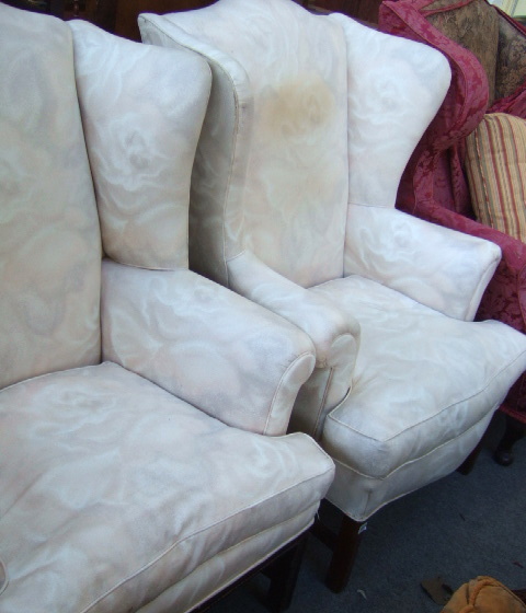 Appraisal: A mahogany mid th century style framed wing back armchair