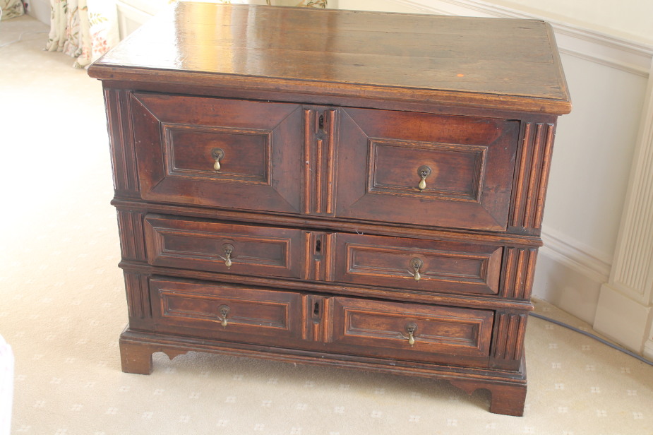 Appraisal: A late thC oak chest of three drawers with pear