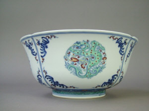 Appraisal: Chinese bowl decorated in colours with four panels of dragons