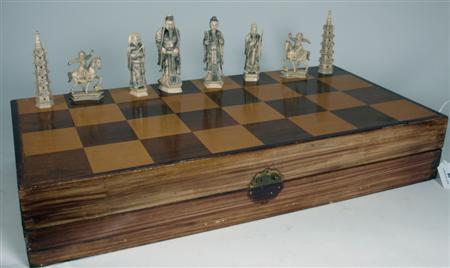 Appraisal: A Chinese export cased carved ivory chess set the figural