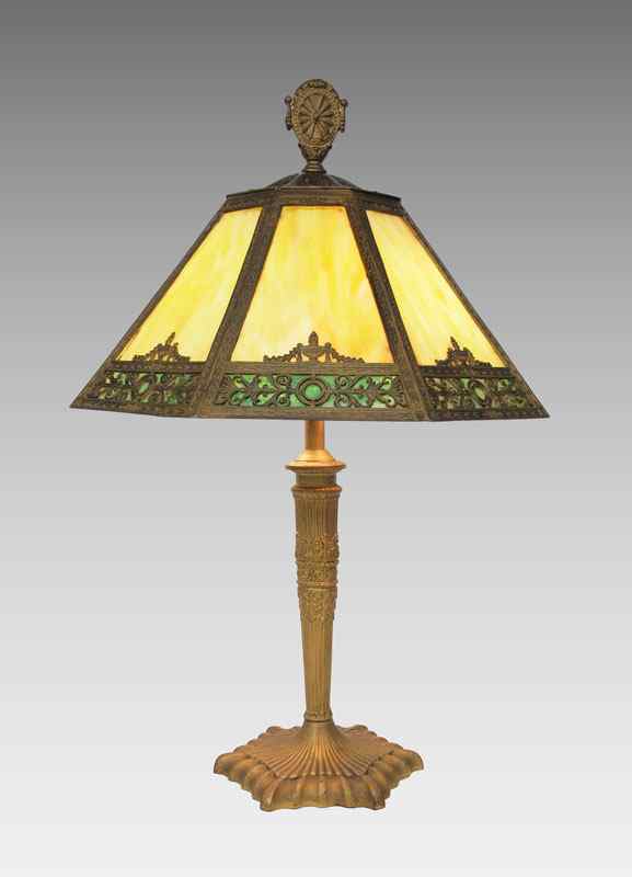 Appraisal: VINTAGE PANEL SLAG GLASS TABLE LAMP Heavy bronze base with