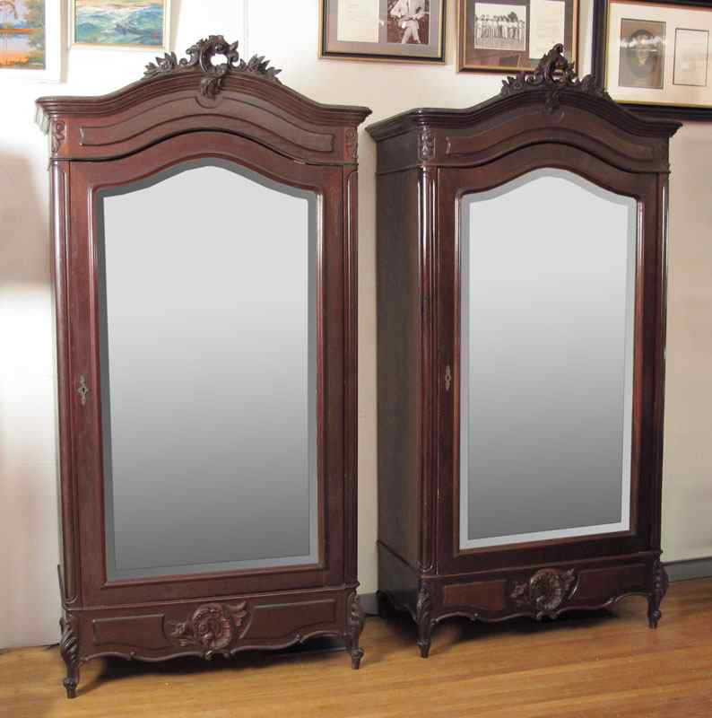 Appraisal: FRENCH ARMOIRES Single mirror front door arched crest surmounted by