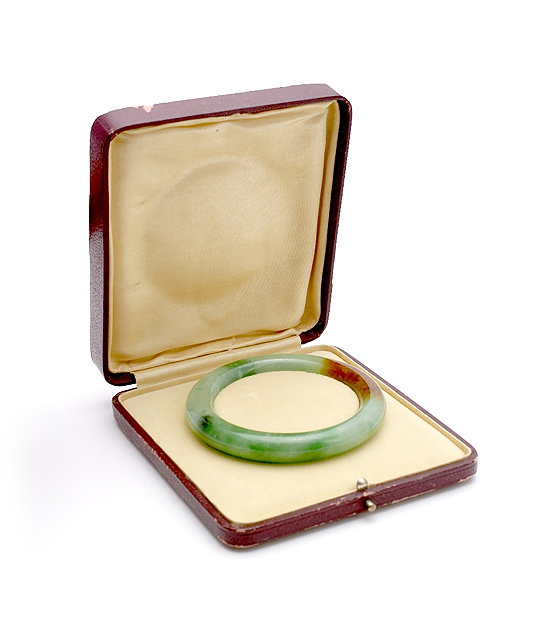 Appraisal: A Chinese spinach green and brown jade bangle th Century