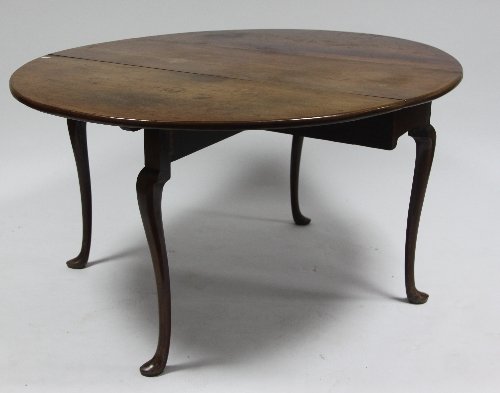 Appraisal: A red walnut two-flap table raised on cabriole legs with