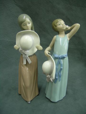 Appraisal: Two Lladro Porcelain Figurines Girls with hats both approximately tall