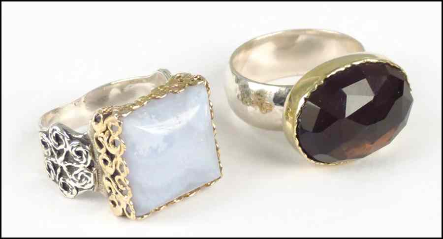 Appraisal: FACETED SMOKY TOPAZ KARAT YELLOW GOLD AND STERLING SILVER RING