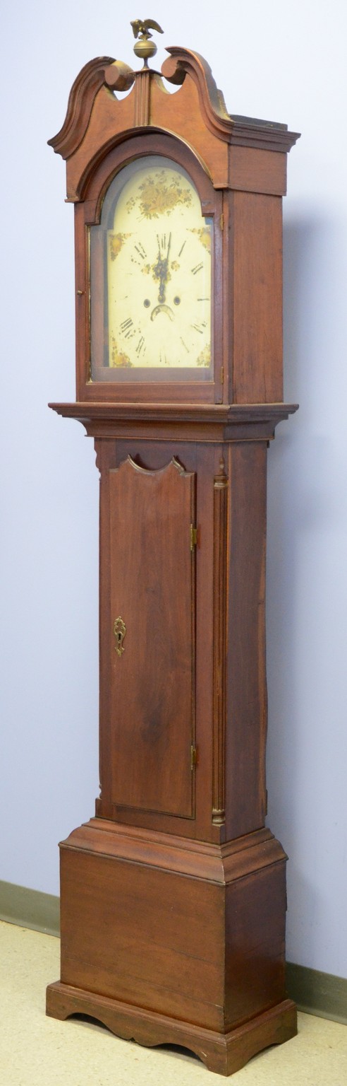 Appraisal: Mahogany tall case clock scroll top bonnet containing a hour