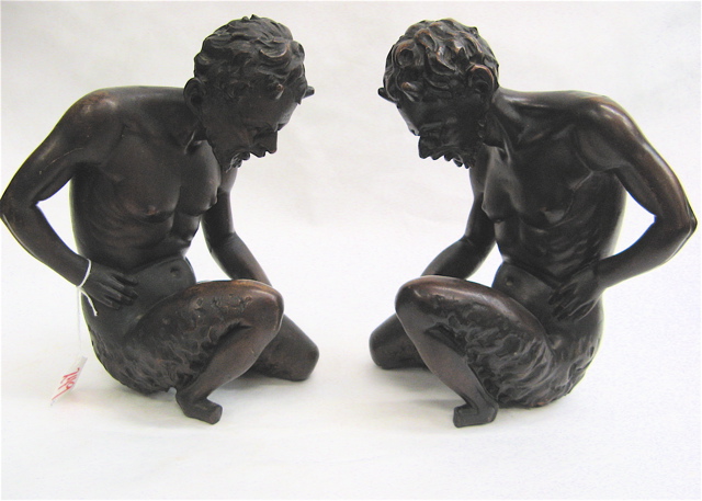 Appraisal: PAIR CARVED AND STAINED WOOD BOOKENDS depicting the mythological faun