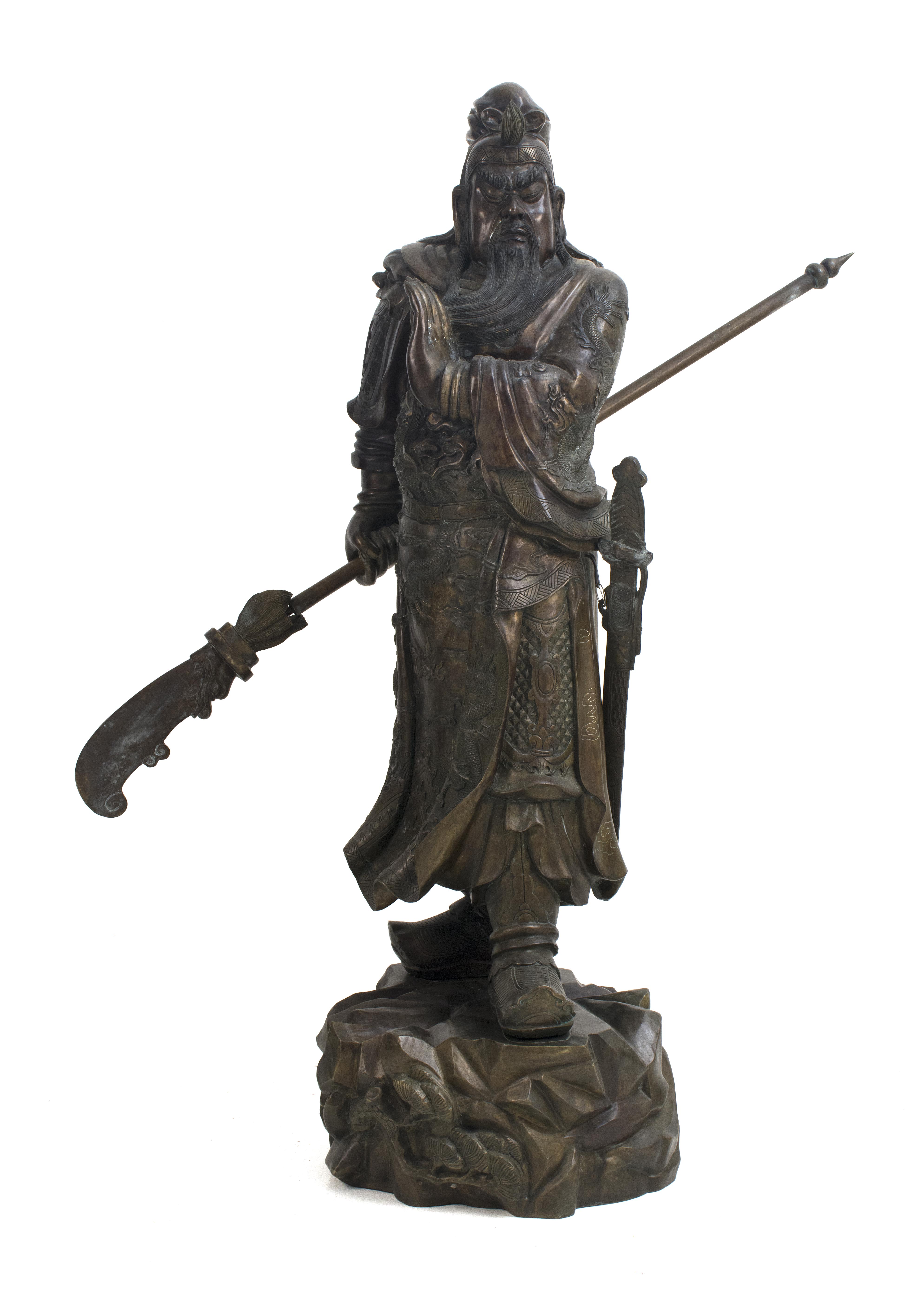 Appraisal: BRONZE FIGURE OF GUANDI th CenturyStanding on a rockery base