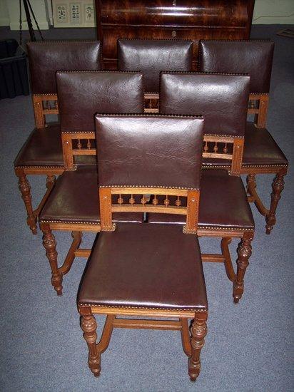 Appraisal: A set of six oak dining chairs the upholstered galleried