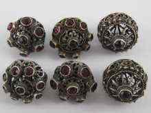 Appraisal: A set of six German marked silver filigree buttons set