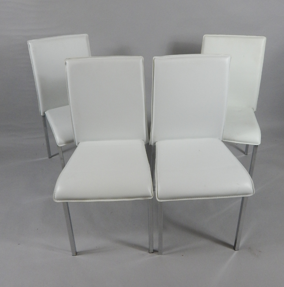 Appraisal: A set of four white leather and aluminium framed single