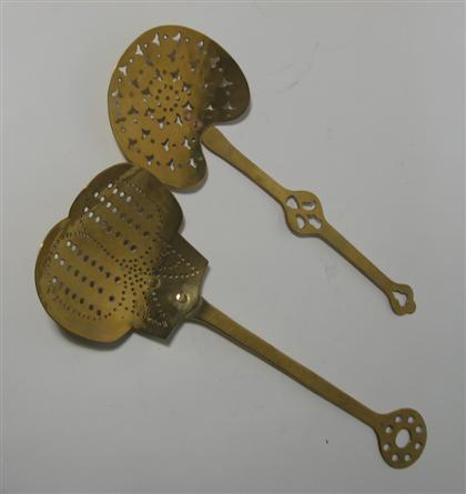 Appraisal: Pair of brass and copper kitchen utensils With pierced decoration