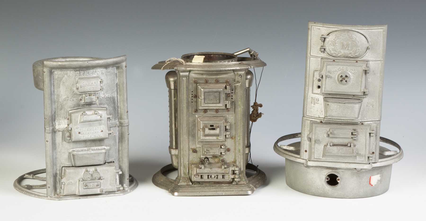 Appraisal: Three Patent Model Furnaces L to R Utica Heater Co