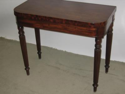 Appraisal: A MAHOGANY FOLDING CARD TABLE of D form the swivel