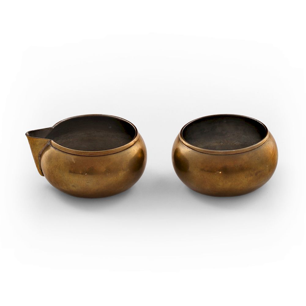 Appraisal: Maija Heikinheimo A brassy sugarer and creamer designed by Maija